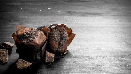 Chocolate muffins with chunks of chocolate.