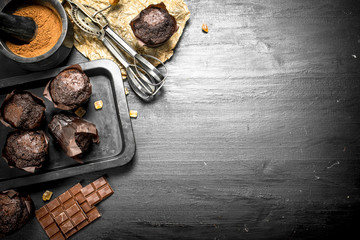 Chocolate muffins with ingredients.