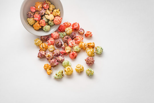 A pile of colorful popcorn, still life for a holiday with colorful popcorn isolated on white