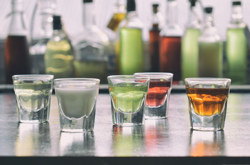 Selection of alcoholic drinks. Set of wine, brandy, liqueur, tincture, cognac, whiskey in glasses,...