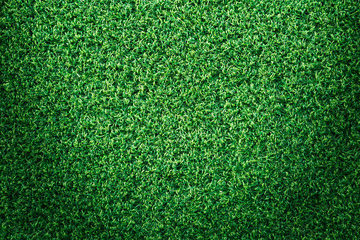 Obraz premium Green grass texture or green grass background for golf course. soccer field or sports background concept design. Artificial green grass.