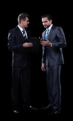 two business partners discussing documents