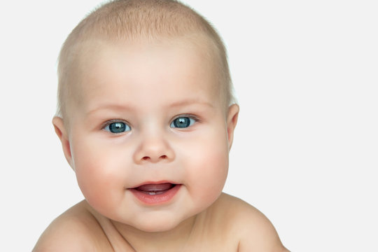 Closeup portrait of baby with first tooth
