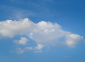 Little clouds on the blue sky background