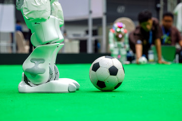 Close-up legs of soccer robot on soccer arena