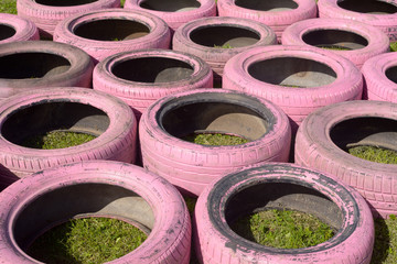 Tyres painted pink arranged as an obstacle on cross-country running event
