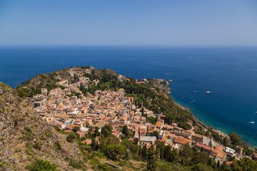 Fototapeta na wymiar Taormina, Sicily, Italy. The historical center of the city and the ruins of the ancient Greek theater