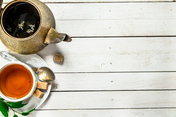 Mug with black tea.