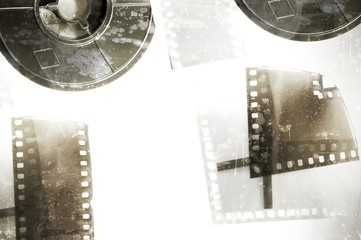 Film and film reel on white background.