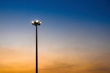 Pillar spotlights and light in evening.