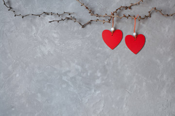 Background for congratulations on Valentines Day with red hearts, a branch