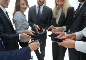 close-up of smartphones in the hands of business youth