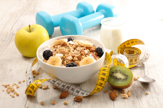 bowl of cereal, fruit and dumbbell