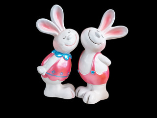 Double rabbit made of ceramic, isolated on black background with clipping path