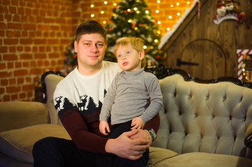 Fototapeta premium family together celebrates the holidays new year's new year and christmas and are very happy together