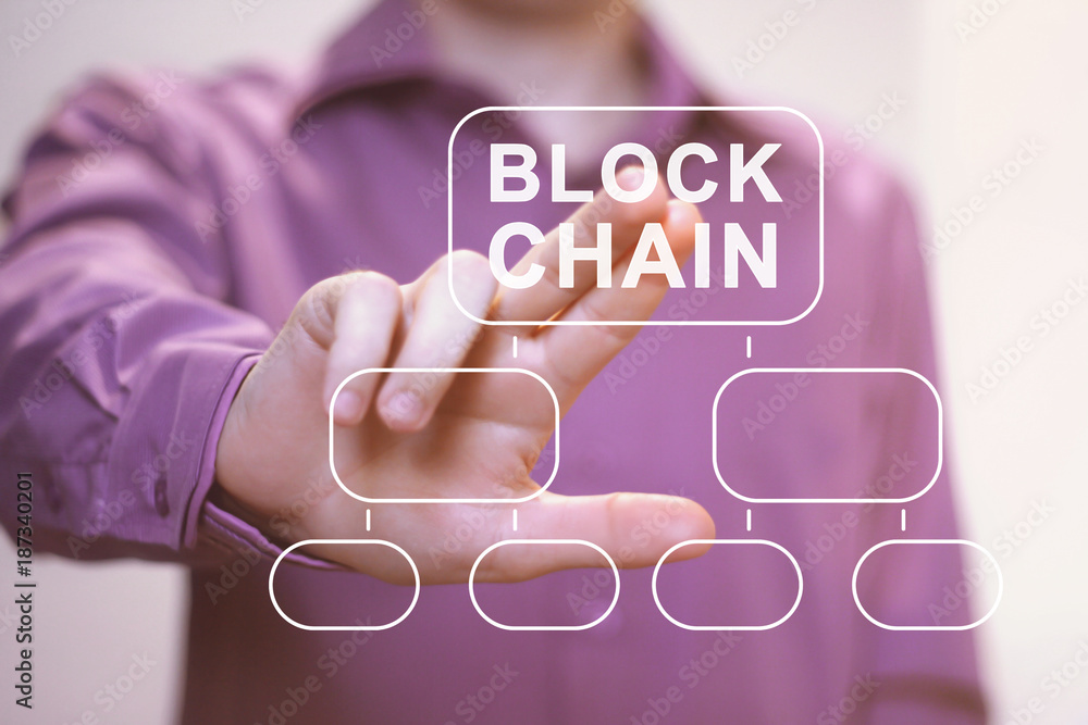 Poster businessman presses button blockchain on virtual digital electronic user interface.