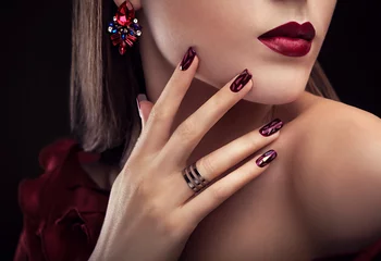 Poster Beautiful woman with perfect make-up and manicure wearing jewellery © maryviolet