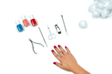 Fototapeta premium Beautiful female hand with red manicure