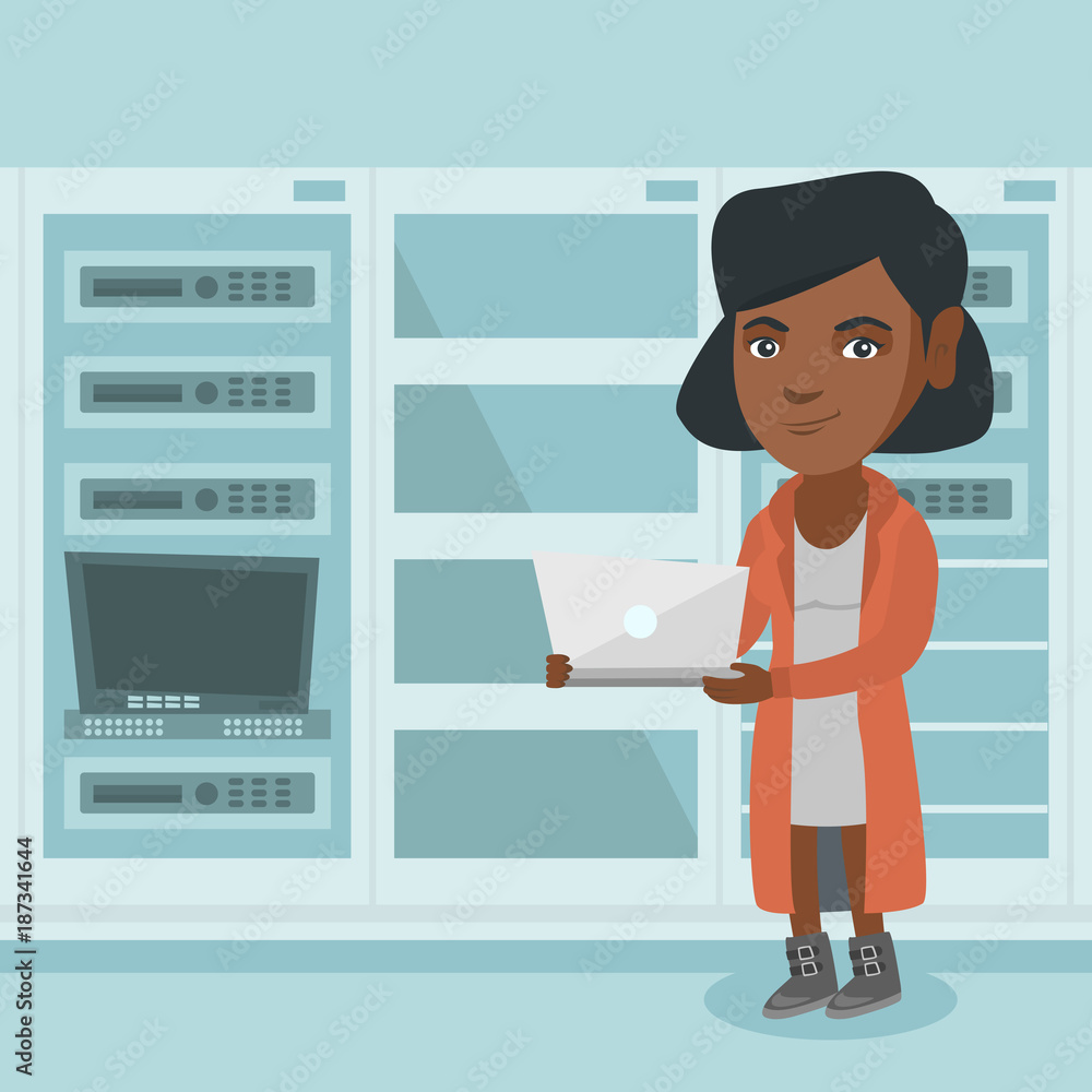 Poster young african-american engineer working on a laptop in the network server room at the data centre. n