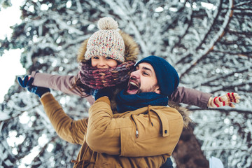 Dad with daughter outdoor in winter