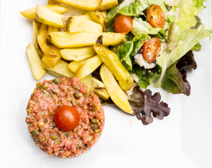 tasty Steak tartare (Raw beef) - classic steak tartare on white plate
