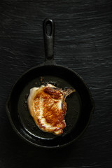 pork steak in a frying pan