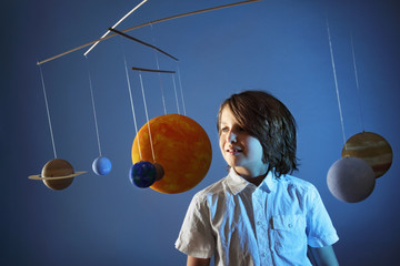 Kids and Science, self made Solar System Project - Studio shots with Young happy Boy © mvc_stock