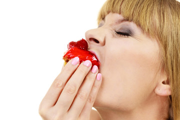 Woman eating cupcake sweet food