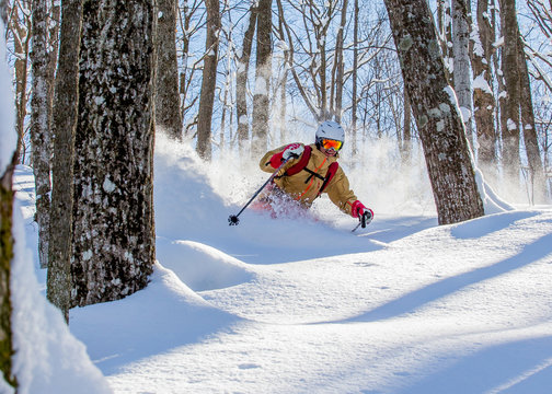 Man skiing powder snow in Ontario, Canada