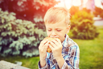 The boy is eating a hamster, closeup