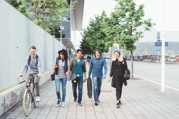 group of friends multiethnic walking outdoor having fun - friendship, interaction, getting away...