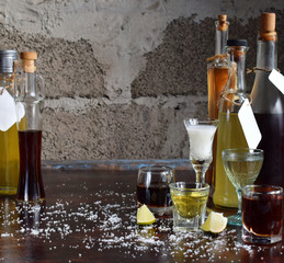 Selection of alcoholic drinks. Set of wine, brandy, liqueur, tincture, cognac, whiskey in glasses,...