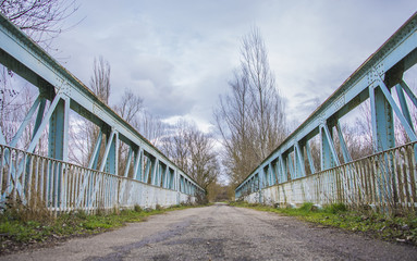 Old iron bridge on the old road.