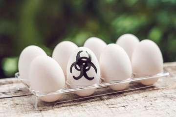 Sign of bio-hazard on the egg. The concept of disease. Avian influenza, salmanese
