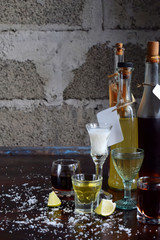 Selection of alcoholic drinks. Set of wine, brandy, liqueur, tincture, cognac, whiskey in glasses,...