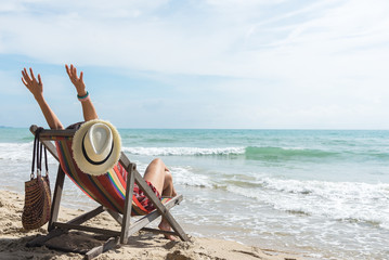 happy woman with open arms enjoying the summer sea vacation .Summer holiday concept