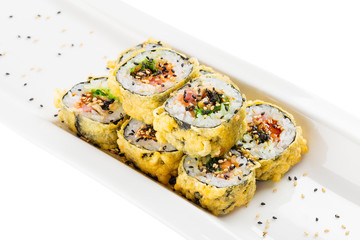 Tempura maki sushi - deep fried hot sushi roll with salmon, tuna, eel, chukka and sesame