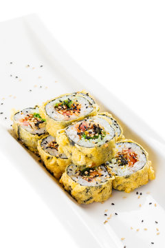 Tempura maki sushi - deep fried hot sushi roll with salmon, tuna, eel, chukka and sesame