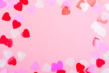 Decorative hearts confetti on pink background
