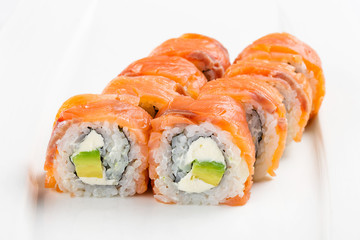 Philadelphia roll urumaki sushi made of fresh salmon, cream cheese, and avocado