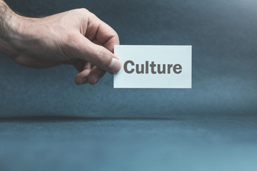 Hand showing text culture on business card.