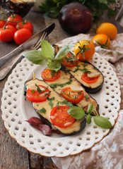 Baked eggplants stuffed with vegetable and cheese