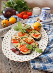 Baked eggplants stuffed with vegetable and cheese