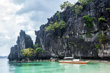 Small bangka boat on the bay of El Nido, Philippines