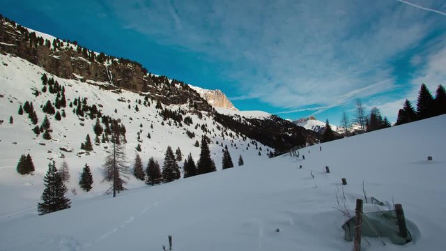 Time lapse mountain landscape with snow during sunny day