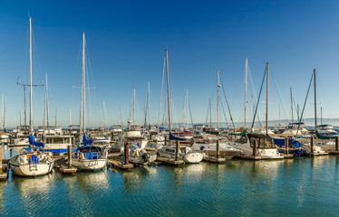 Boats and yachts at marina on sunny morning 