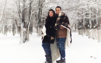 Fototapeta na wymiar A young loving couple on a walk
