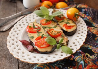 Baked eggplants stuffed with vegetable and cheese