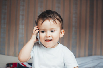 Baby talking on a mobile phone