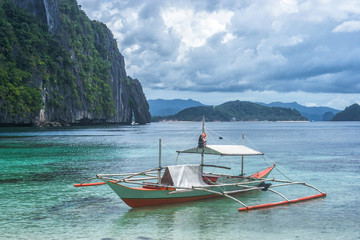 Small bangka boat on the bay of El Nido, Philippines © Alex Pelikh